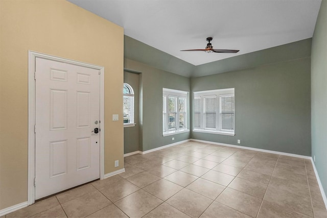 tiled foyer entrance with ceiling fan