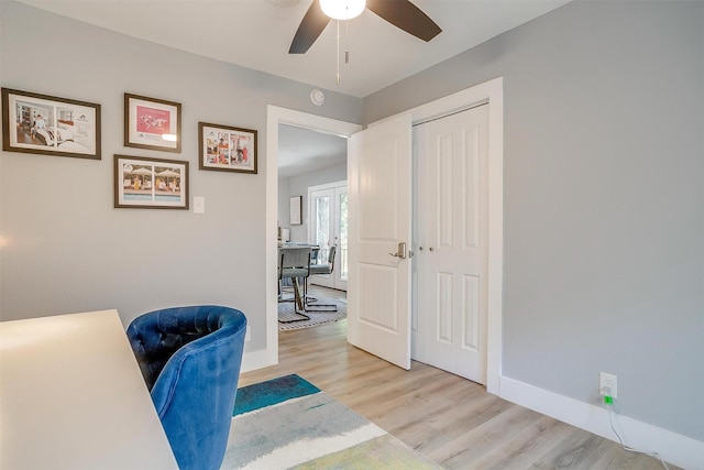 home office with ceiling fan and light wood-type flooring