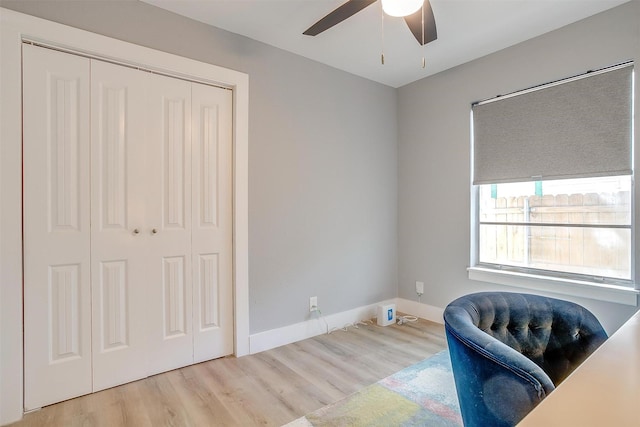 sitting room featuring light hardwood / wood-style floors and ceiling fan