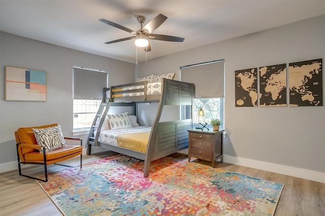 bedroom with ceiling fan and hardwood / wood-style flooring