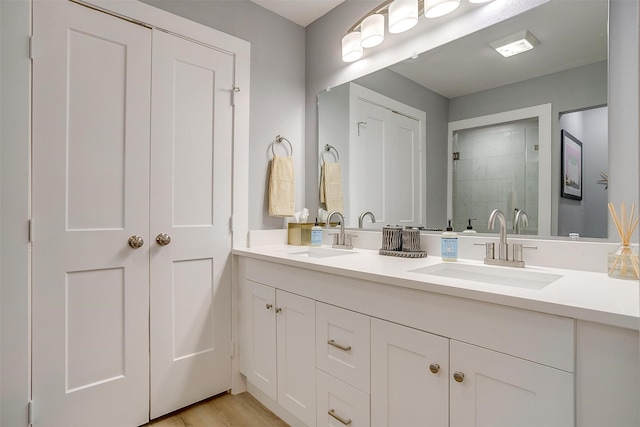 bathroom featuring vanity and hardwood / wood-style flooring