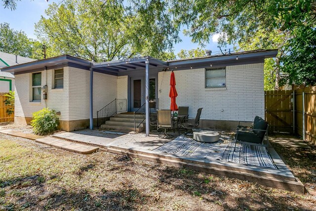 back of property with a patio