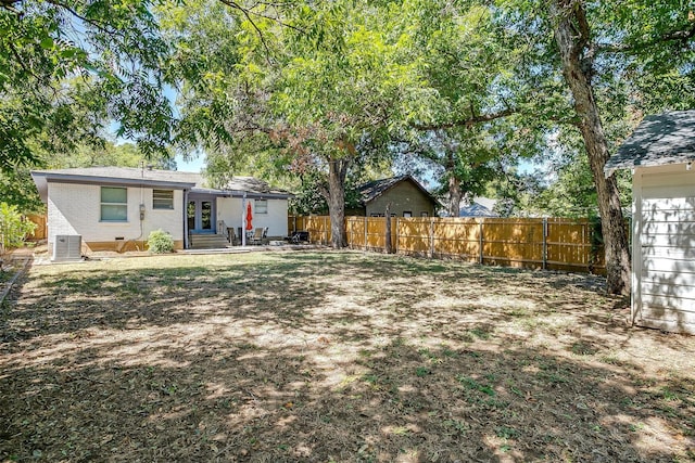 view of yard featuring central AC