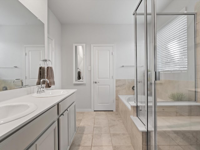 bathroom featuring vanity, tile patterned floors, and shower with separate bathtub