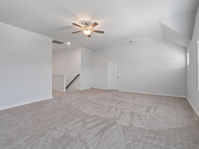 spare room featuring ceiling fan and light colored carpet