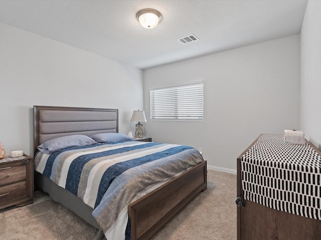 bedroom featuring light colored carpet