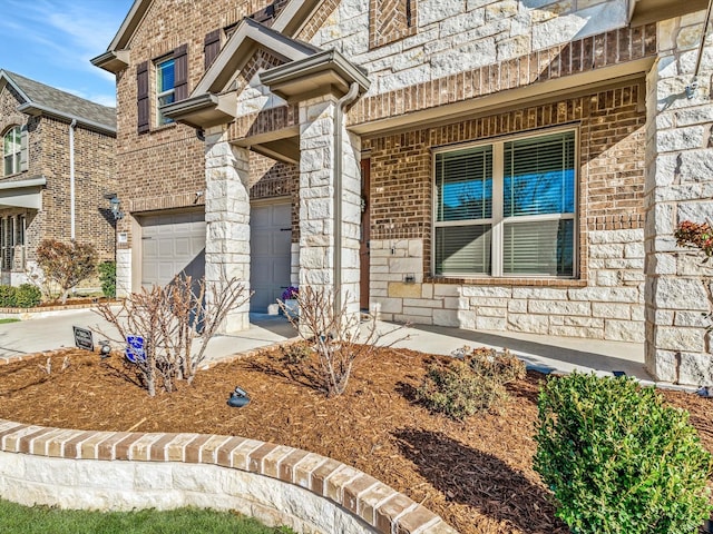 doorway to property featuring a garage