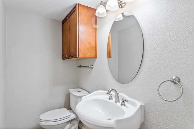 bathroom with sink and toilet