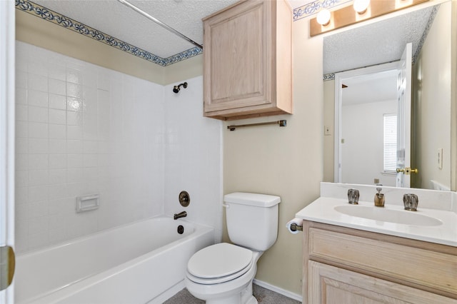 full bathroom featuring toilet, vanity, bathtub / shower combination, and a textured ceiling