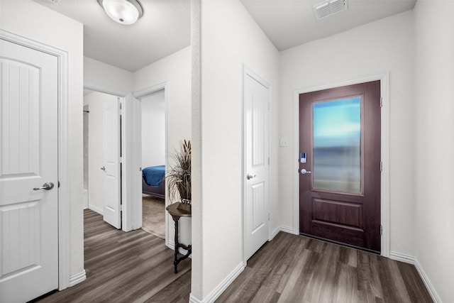 interior space with dark hardwood / wood-style flooring