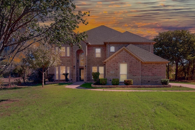 view of front of home with a lawn