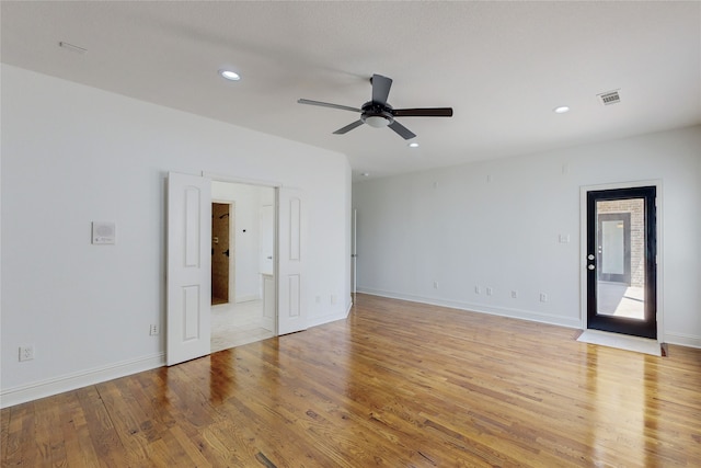 unfurnished room featuring ceiling fan and light hardwood / wood-style floors