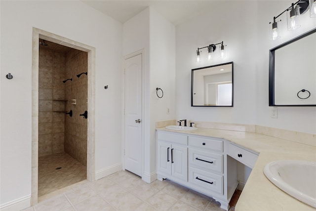 bathroom with vanity, tile patterned floors, and tiled shower