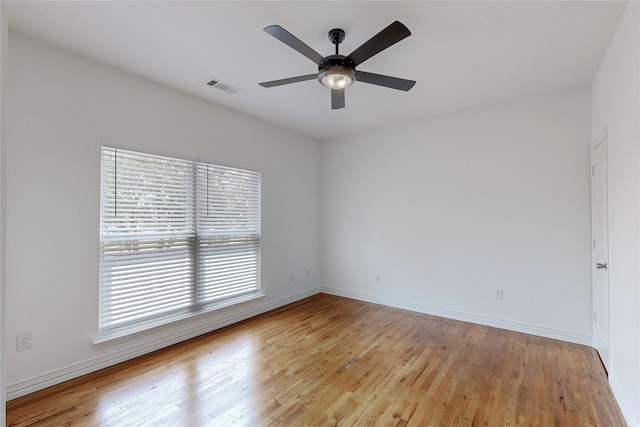 empty room featuring ceiling fan and light hardwood / wood-style floors