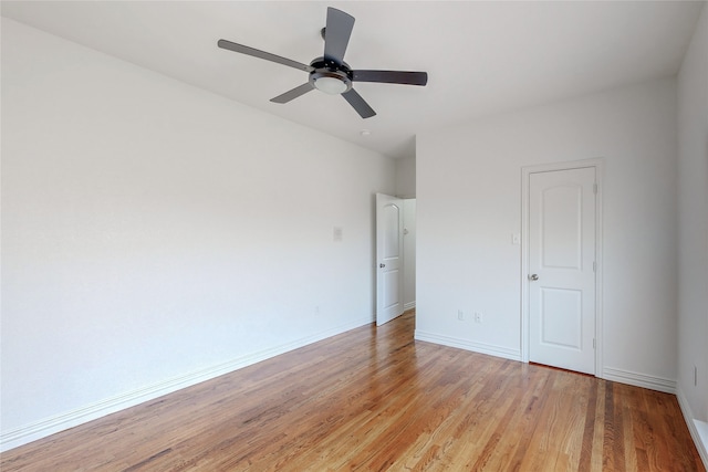 unfurnished room with ceiling fan and light hardwood / wood-style flooring