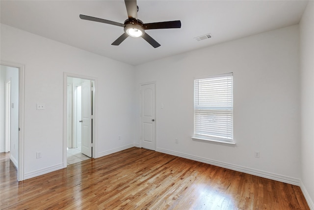 spare room with ceiling fan and light hardwood / wood-style floors