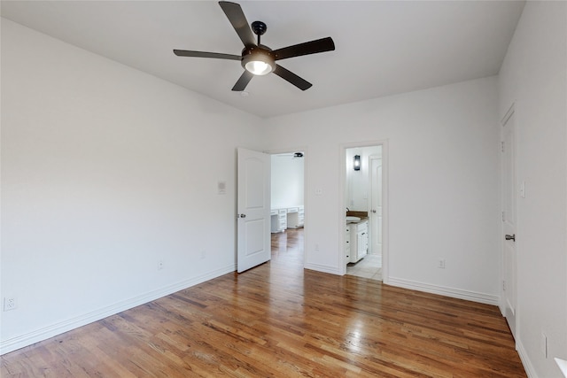 unfurnished bedroom with light hardwood / wood-style flooring, ceiling fan, and ensuite bathroom