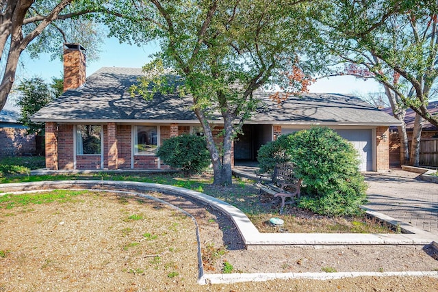 ranch-style home with a garage