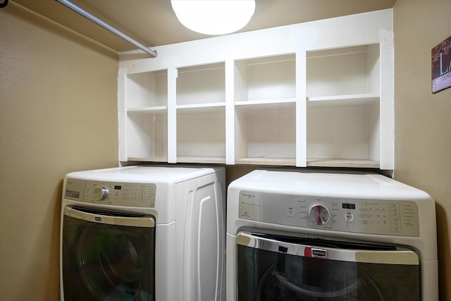 laundry room featuring separate washer and dryer