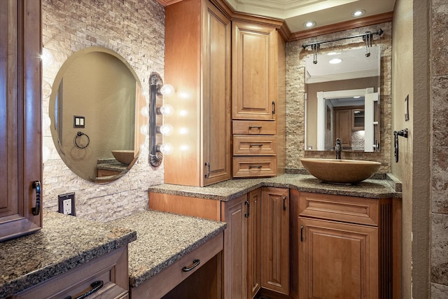 bathroom featuring vanity and crown molding