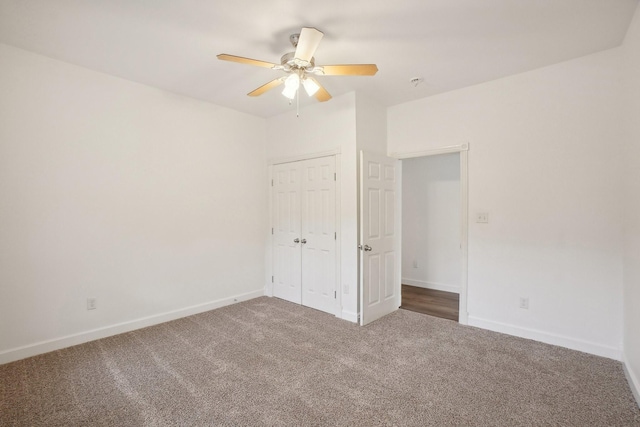 unfurnished bedroom with carpet, ceiling fan, and a closet