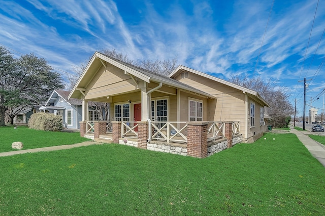 view of property exterior with a lawn and a porch