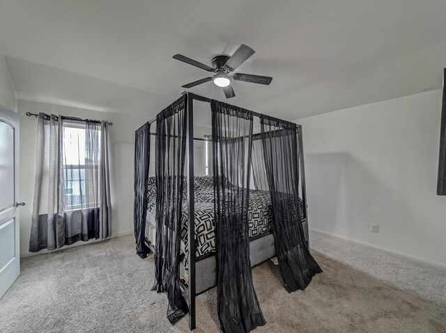 bedroom featuring light carpet and ceiling fan