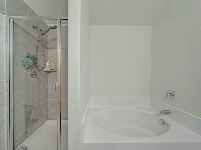 bathroom with separate shower and tub