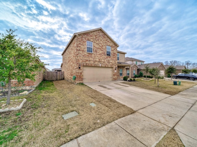 view of property with a front lawn and a garage