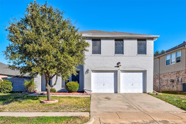 view of front of home featuring a garage, central AC, and a front lawn