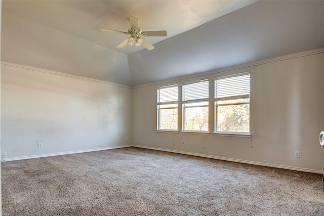 carpeted spare room with vaulted ceiling and ceiling fan