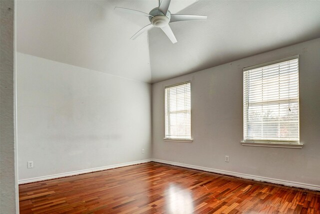 unfurnished room featuring wood-type flooring, vaulted ceiling, and ceiling fan