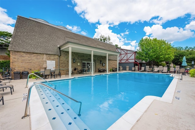 view of pool featuring a patio