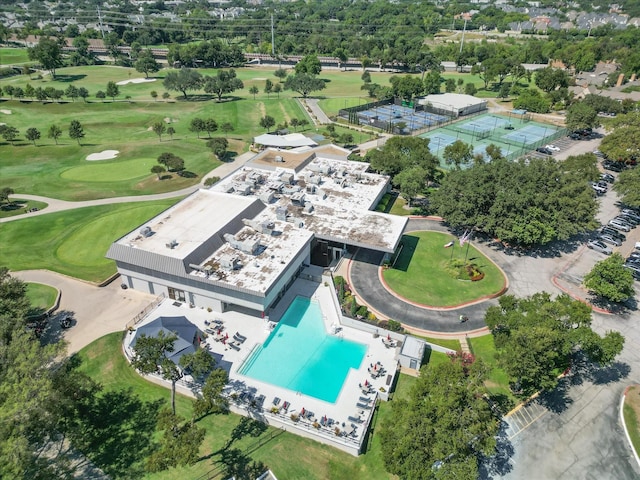 birds eye view of property with view of golf course