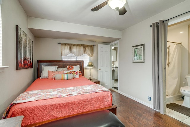 bedroom featuring ensuite bathroom, ceiling fan, and dark wood-type flooring