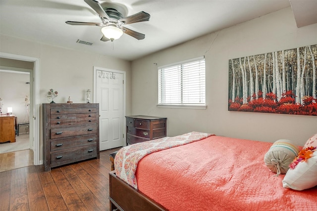 bedroom featuring ceiling fan and dark hardwood / wood-style flooring