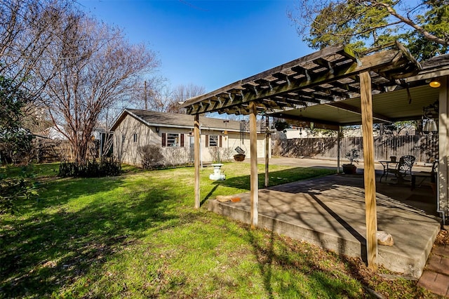 view of yard with a pergola and a patio area