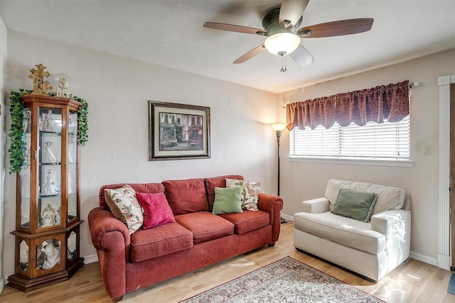 living room featuring hardwood / wood-style flooring and ceiling fan