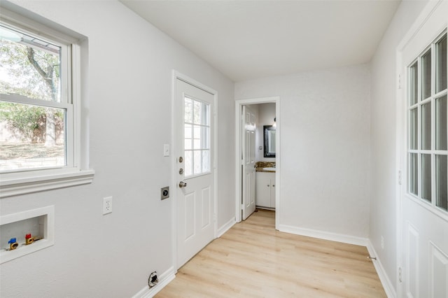 entryway with light hardwood / wood-style flooring