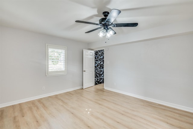 spare room featuring ceiling fan and light hardwood / wood-style floors