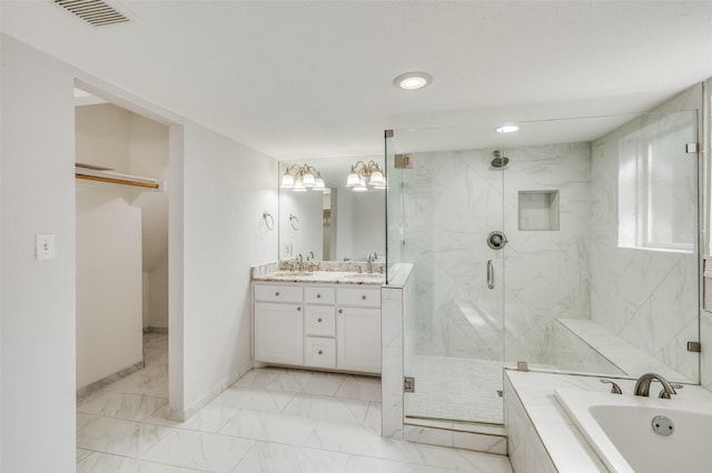 bathroom with shower with separate bathtub and vanity