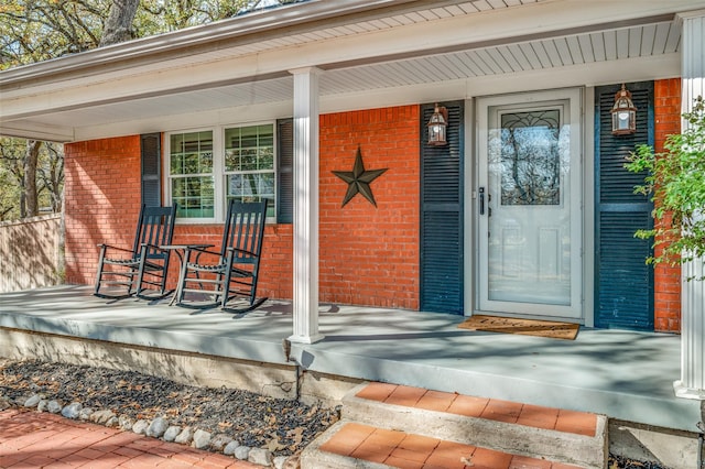 view of exterior entry featuring a porch