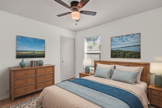 bedroom featuring hardwood / wood-style flooring and ceiling fan