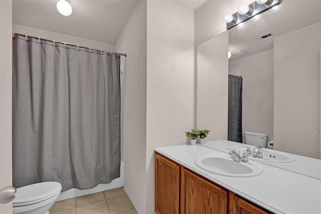 full bathroom featuring vanity, toilet, tile patterned flooring, and shower / bath combo