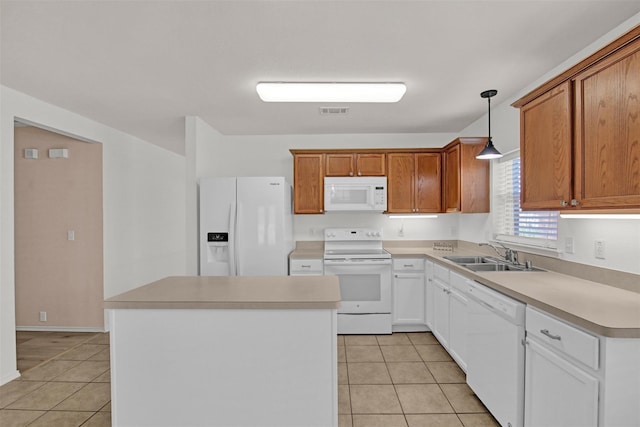 kitchen featuring sink, white appliances, hanging light fixtures, white cabinets, and light tile patterned flooring