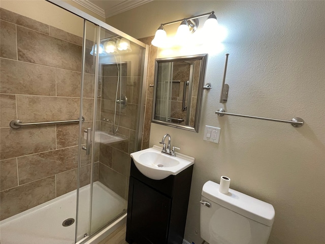 bathroom with crown molding, vanity, toilet, and an enclosed shower