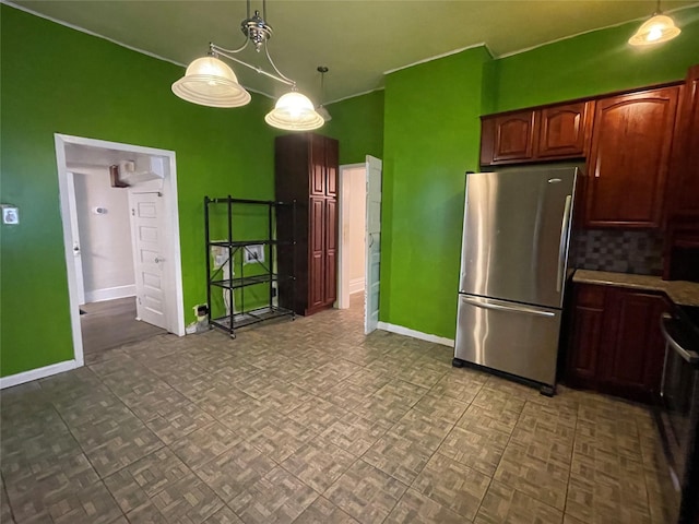 kitchen with stainless steel refrigerator, parquet floors, decorative light fixtures, and electric stove