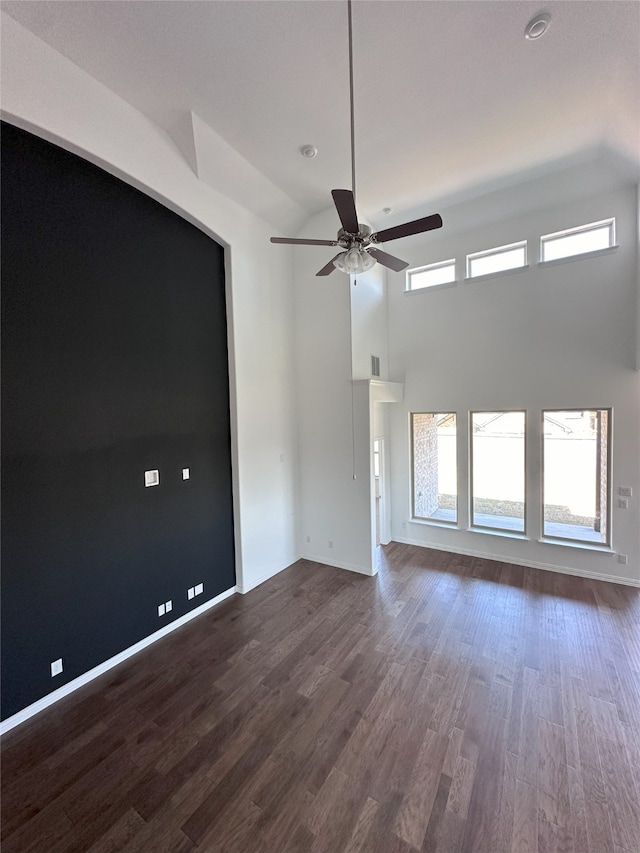 unfurnished room featuring dark hardwood / wood-style flooring and ceiling fan