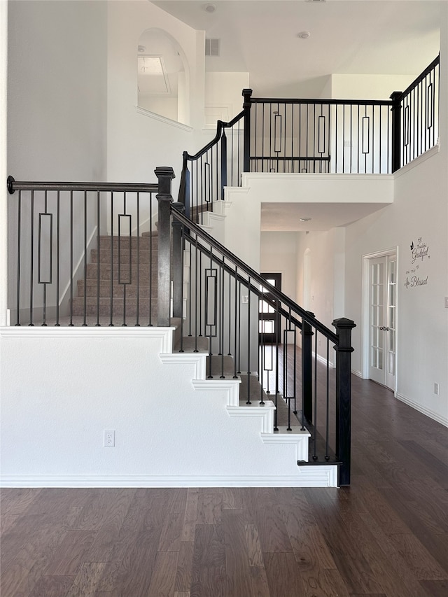 stairway with hardwood / wood-style flooring