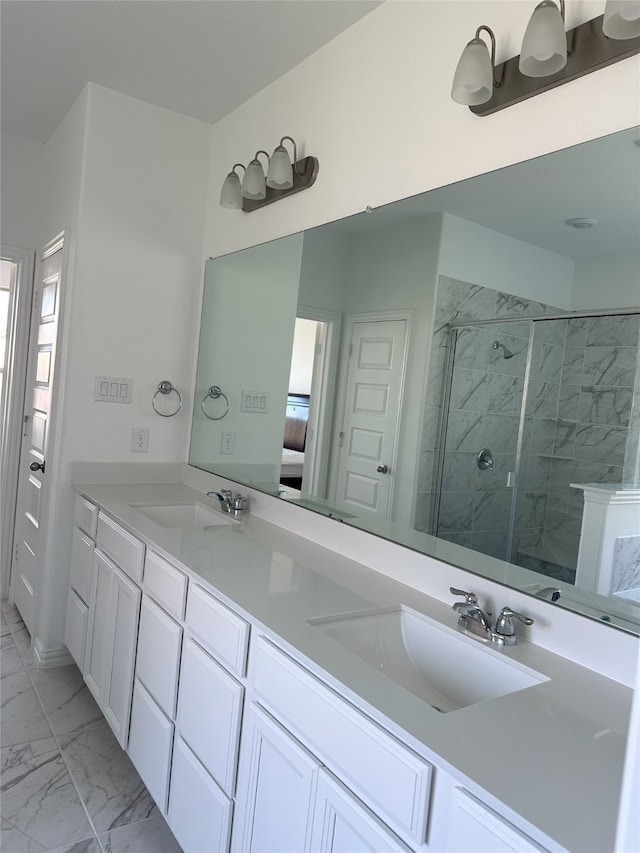 bathroom with vanity and a shower with shower door